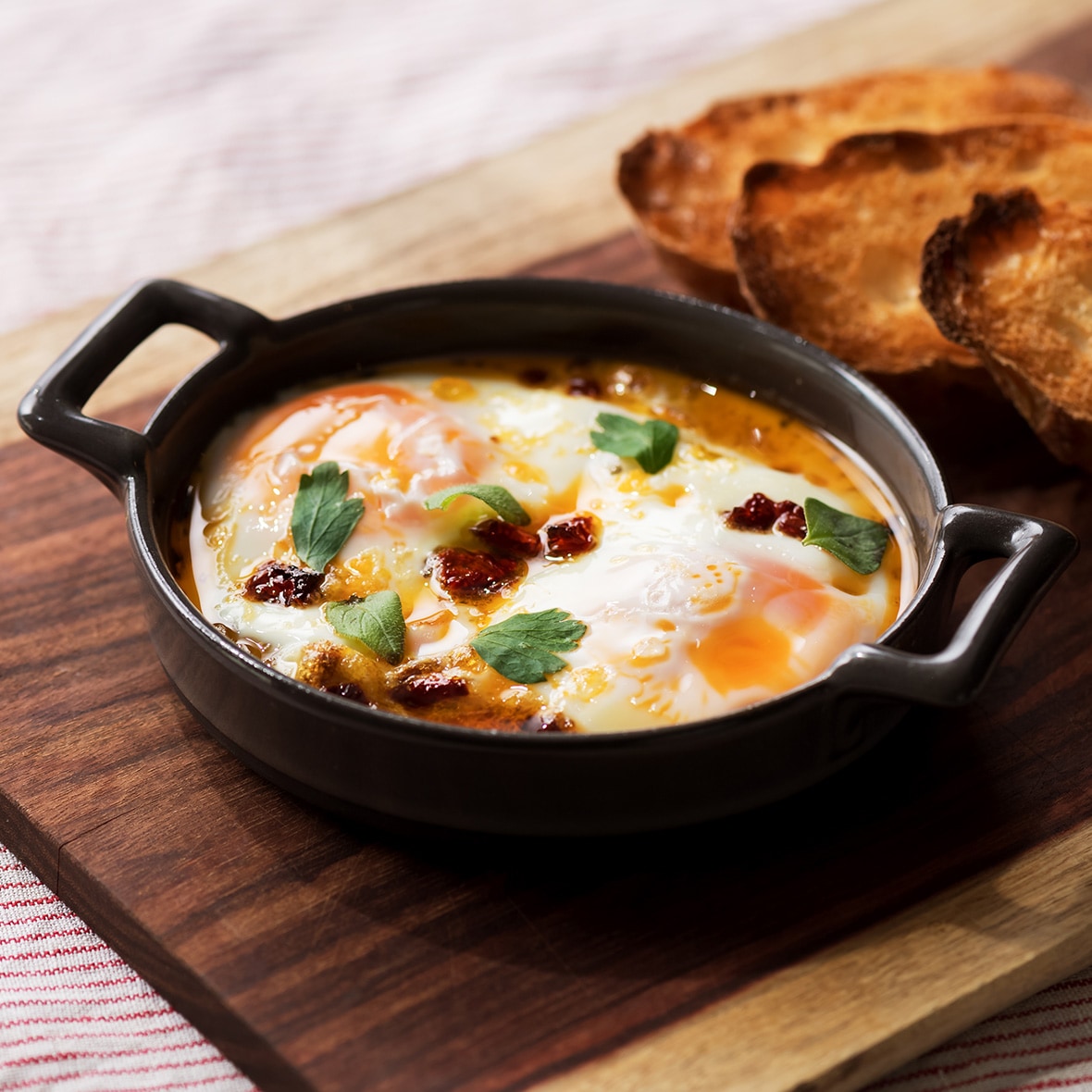 Eggs Baked in Chili Oil <br>with Dried Tomatoes and Oregano 
